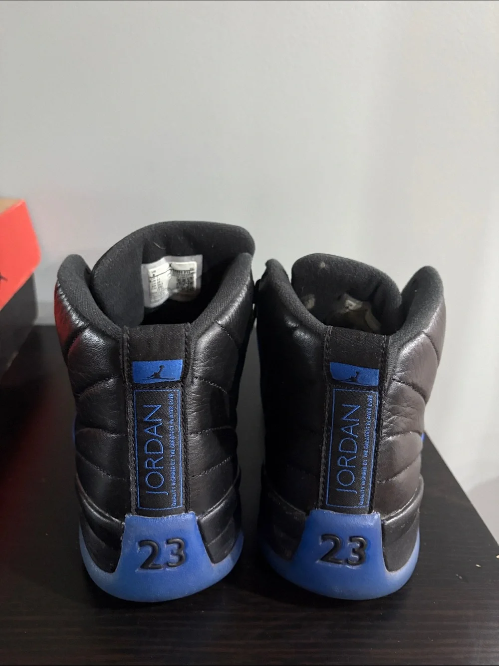 Jordan 12 Retro High Top Sneakers in Black and Royal Blue